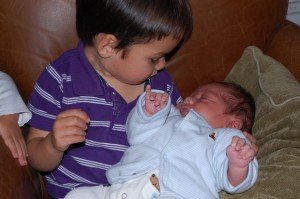 Evan holds his little brother Max