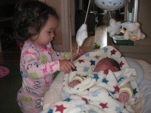 Sophie checking out the real baby