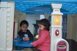 Evan and Sophie (with colds) in thier new house that was a gift from Nanny and Poppy