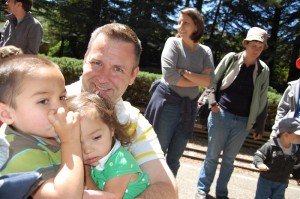 tender moment between brother and sister on train ride in Tilden Park