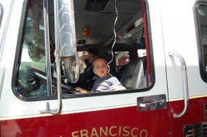 Evan test driving fire engine at Glen Park street fair