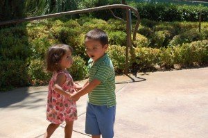 Evan and Sophie playing a game of 'ring around the rosie'